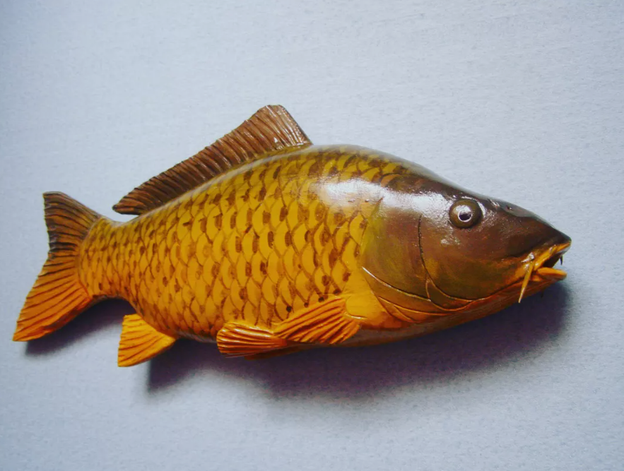 Hand-carved wooden fish by Papa Eugene