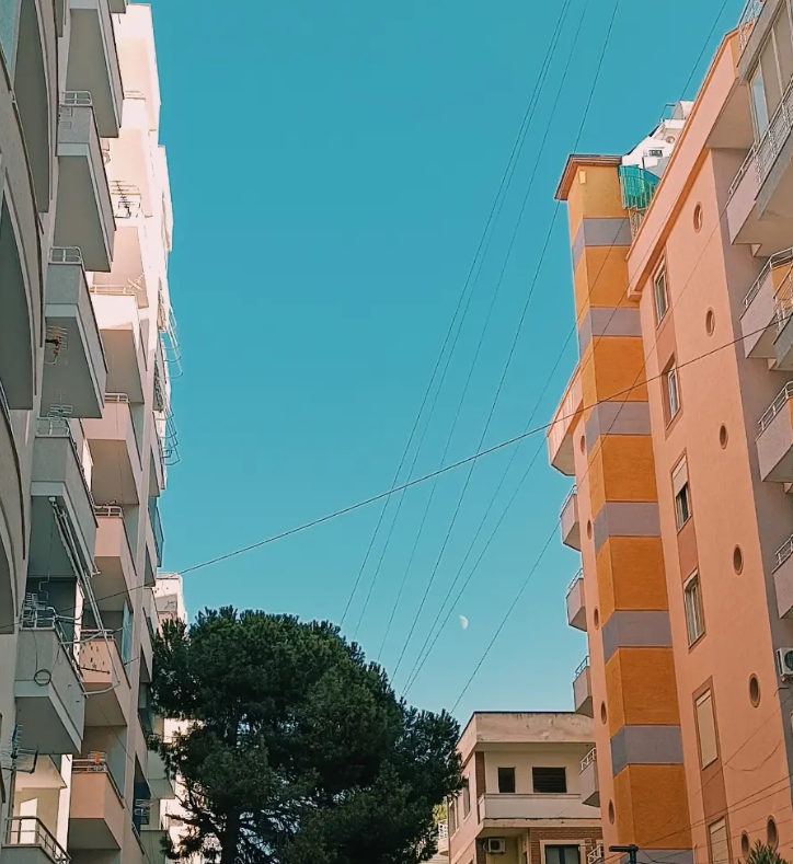 Colourful apartment buildings under a blue sky in Durrës